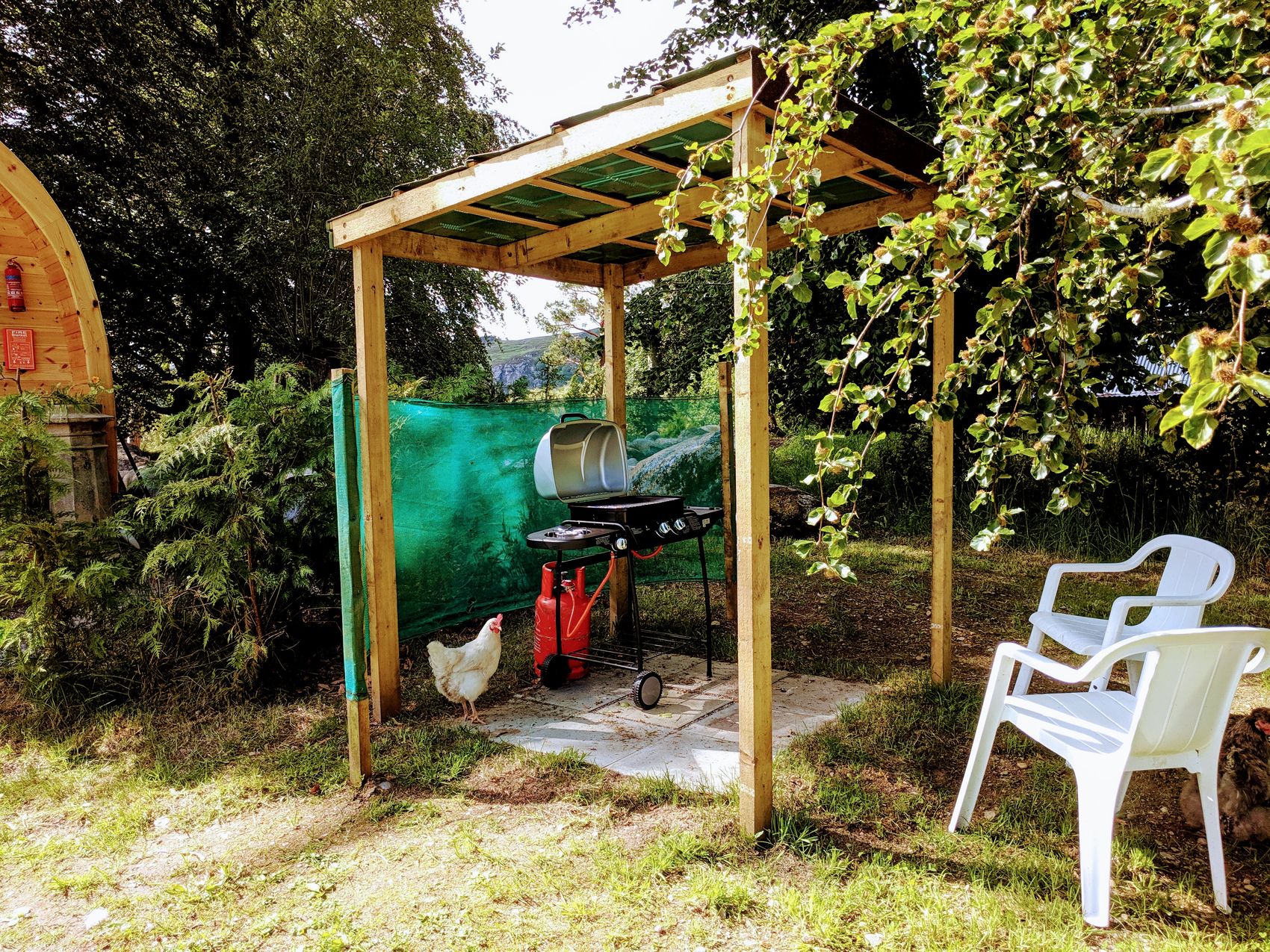 Outdoor BBQ grill setup at lower pod, ready for cooking