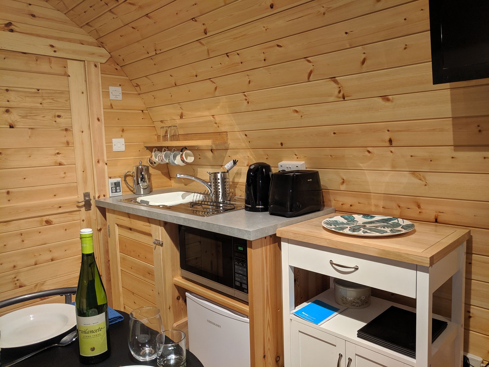 Modern kitchen in lower pod with stainless steel appliances