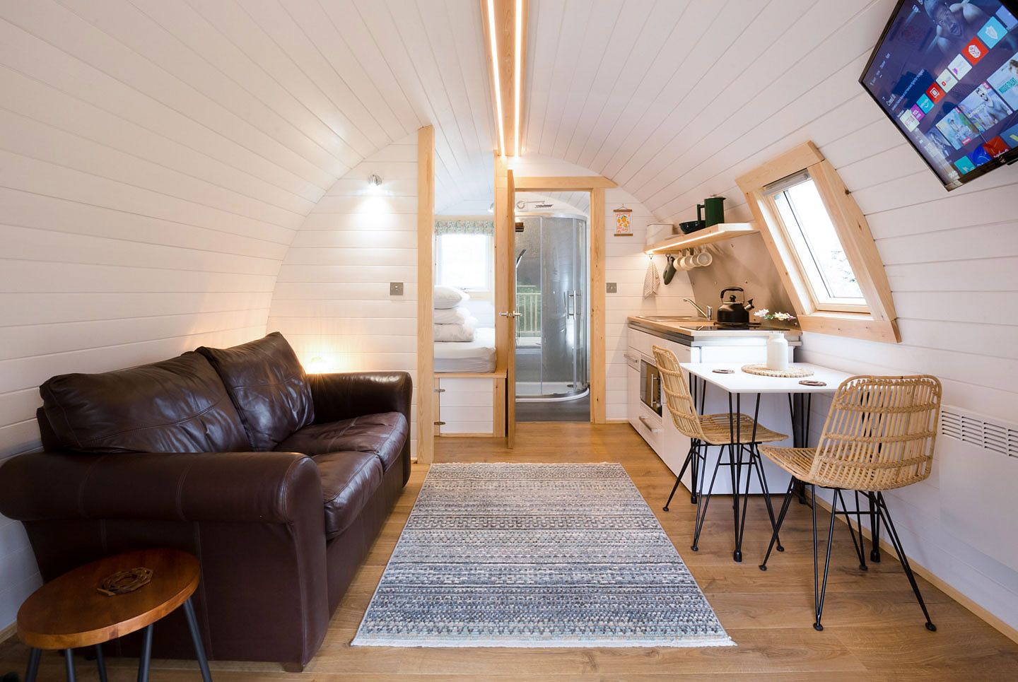 Interior view of upper pod looking towards the back with view of the double bed